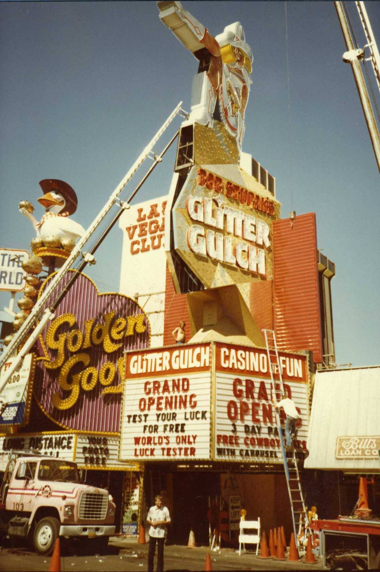 Installation of the Glitter Gulch sign, Las Vegas, 1980
Photo from Nevada State Museum, Las Vegas.
““Las Vegas City Commission approved plans for the construction of ‘Vegas Vicky’ by Bob Stupak to advertise his soon-to-open ‘Glitter Gulch’ casino” -...
